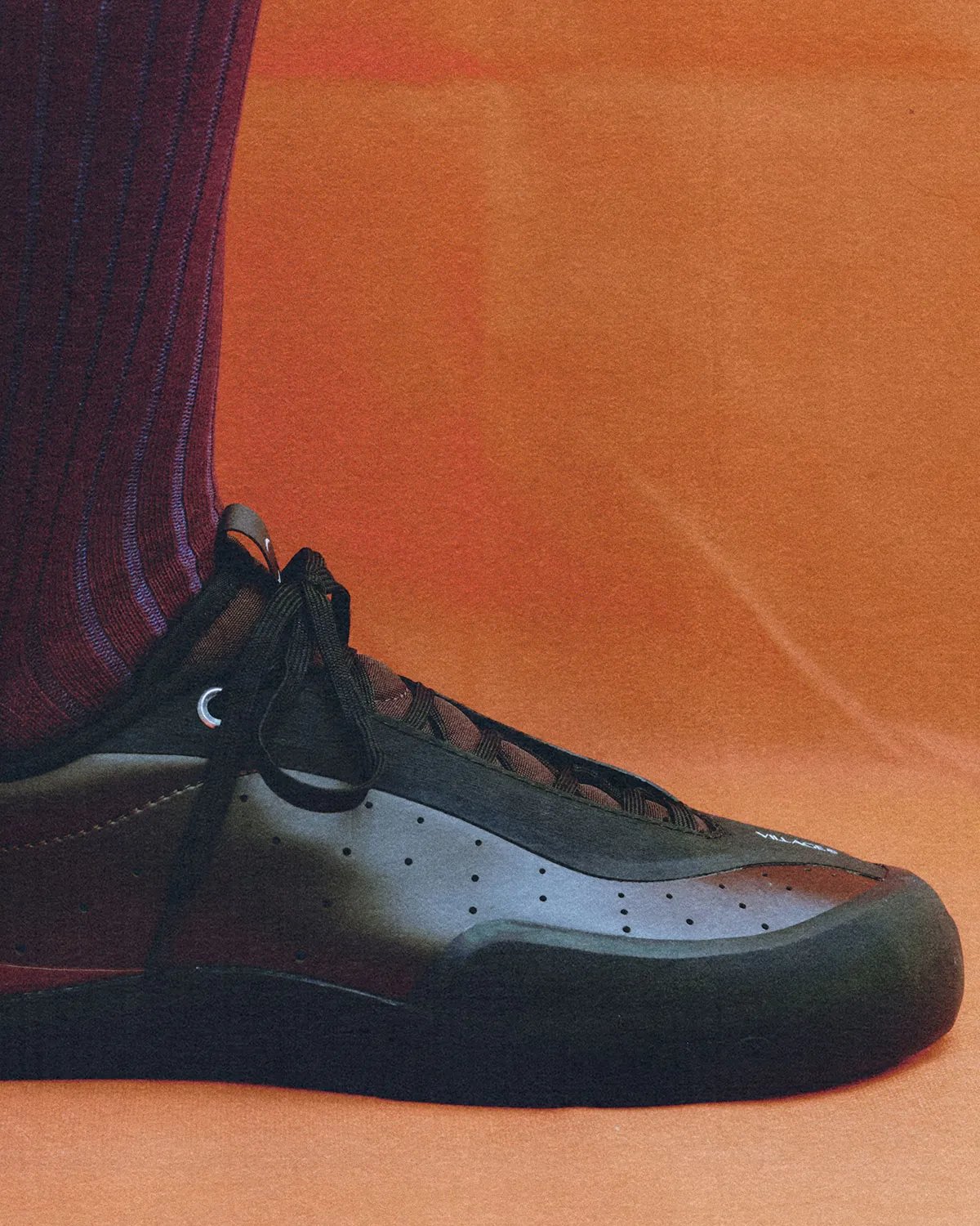 Village PM 2PM silhouette in neutral colorway, showcasing higher-cut structure and asymmetrical design profile