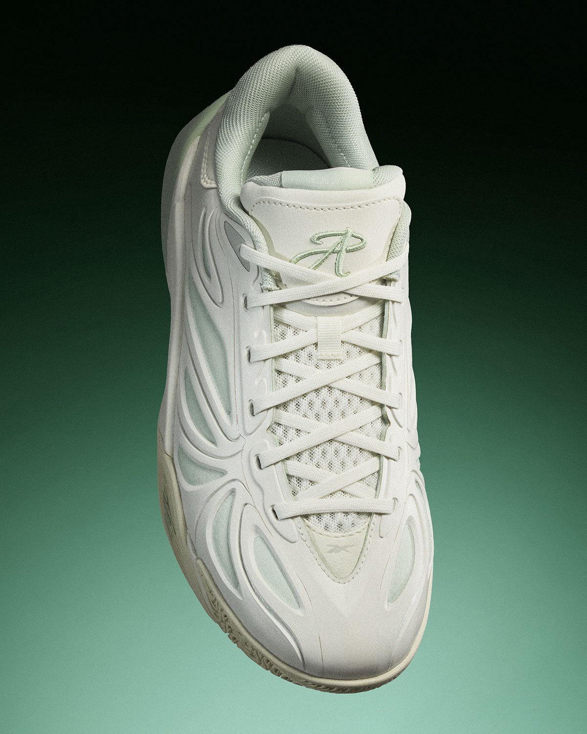 Reebok Angel Reese 1 Metal Green and Aqua colorways displayed side by side, showing muted pastel and vibrant aqua treatments with contrasting heel details - detail view 1