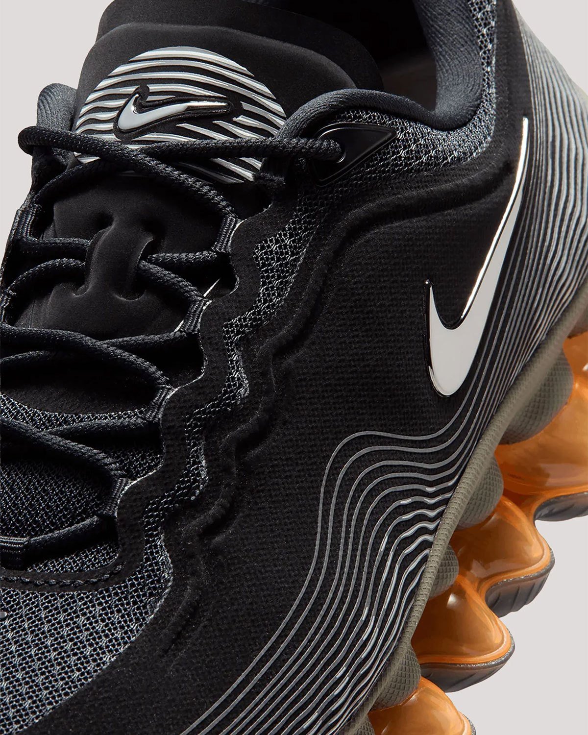 Nike Air Liquid Max Black Metallic with wavy line graphics and chrome Swoosh detail, lateral view - detail view 2