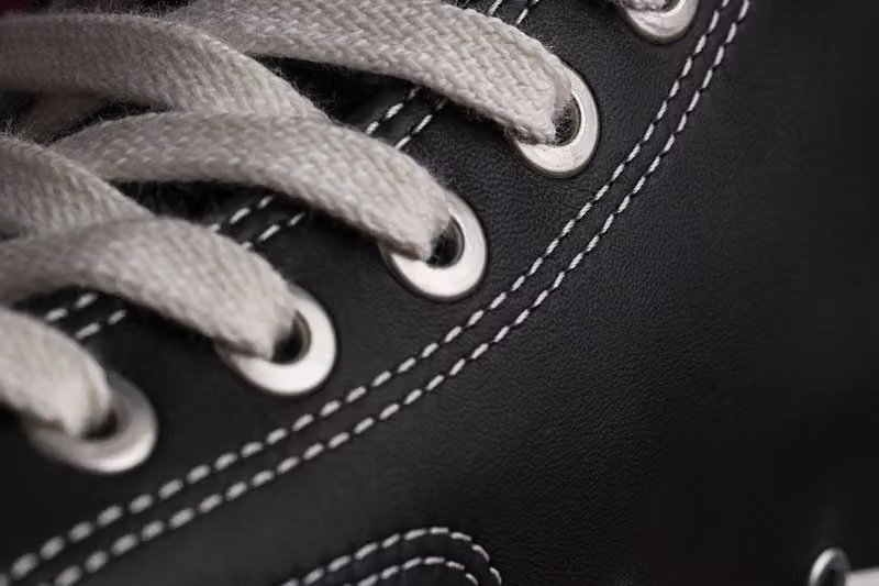Converse First String Chuck Taylor high-top in premium black leather with refined textile finish - detail view 4