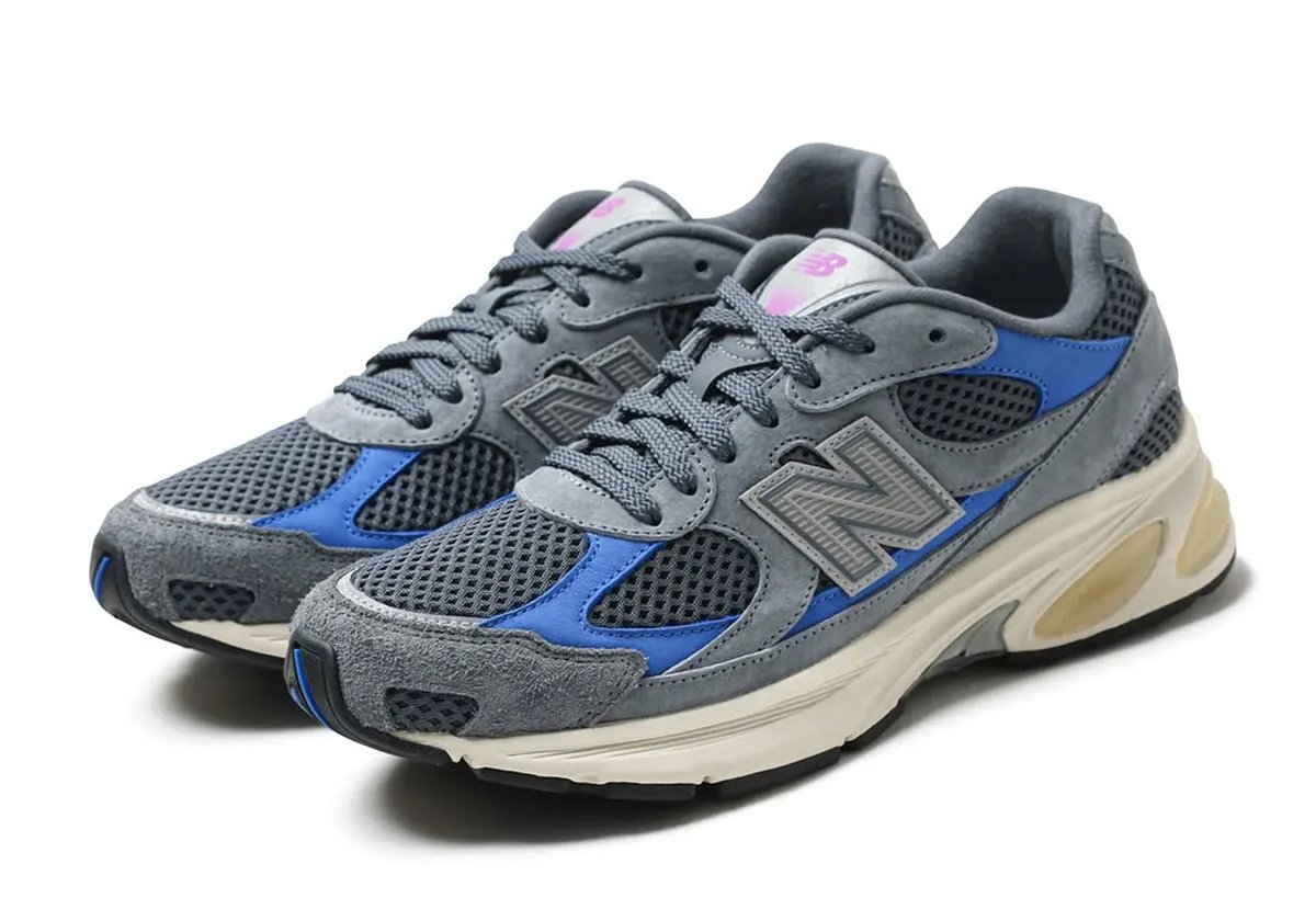 Liberaiders x UNIK x New Balance 2010 'Walk Together, Bonded by True Friendship' sneaker with grey mesh upper, blue underlays, and purple branding accents - detail view 3