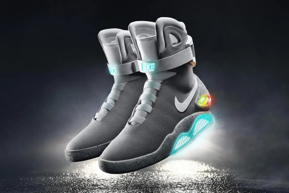 Nike Zoom Vapor 12 Hypersmash in Photon Dust, Wolf Grey, Sky Blue and White, featuring Back to the Future 'Mag' theme with illuminated heel graphics and orange-to-yellow gradient tongue logo - detail view 2