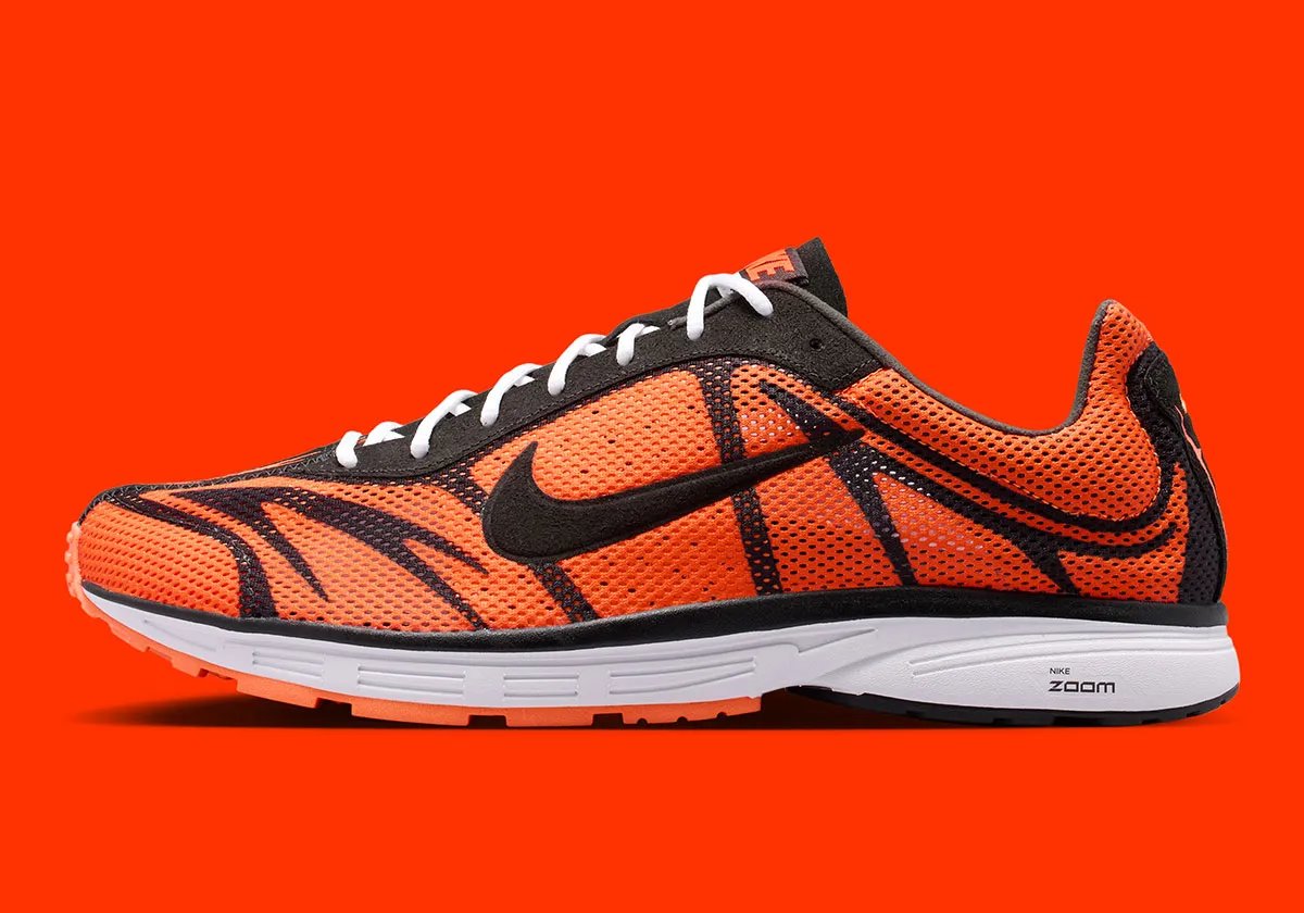 Nike Zoom Streak 3 in Safety Orange colorway with black stripes and white accents on laces and sole - detail view 1