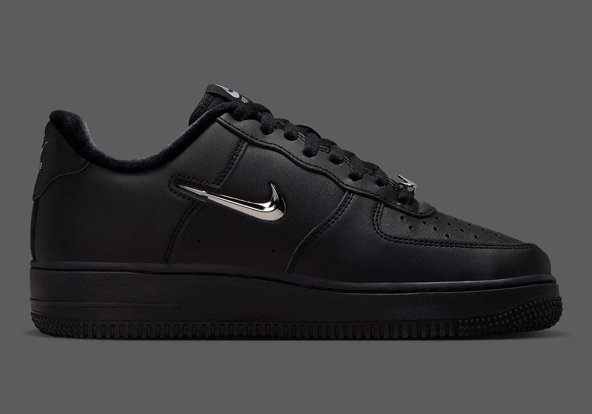 Nike Air Force 1 Low in black leather with chrome silver Swoosh detail, side view - detail view 2