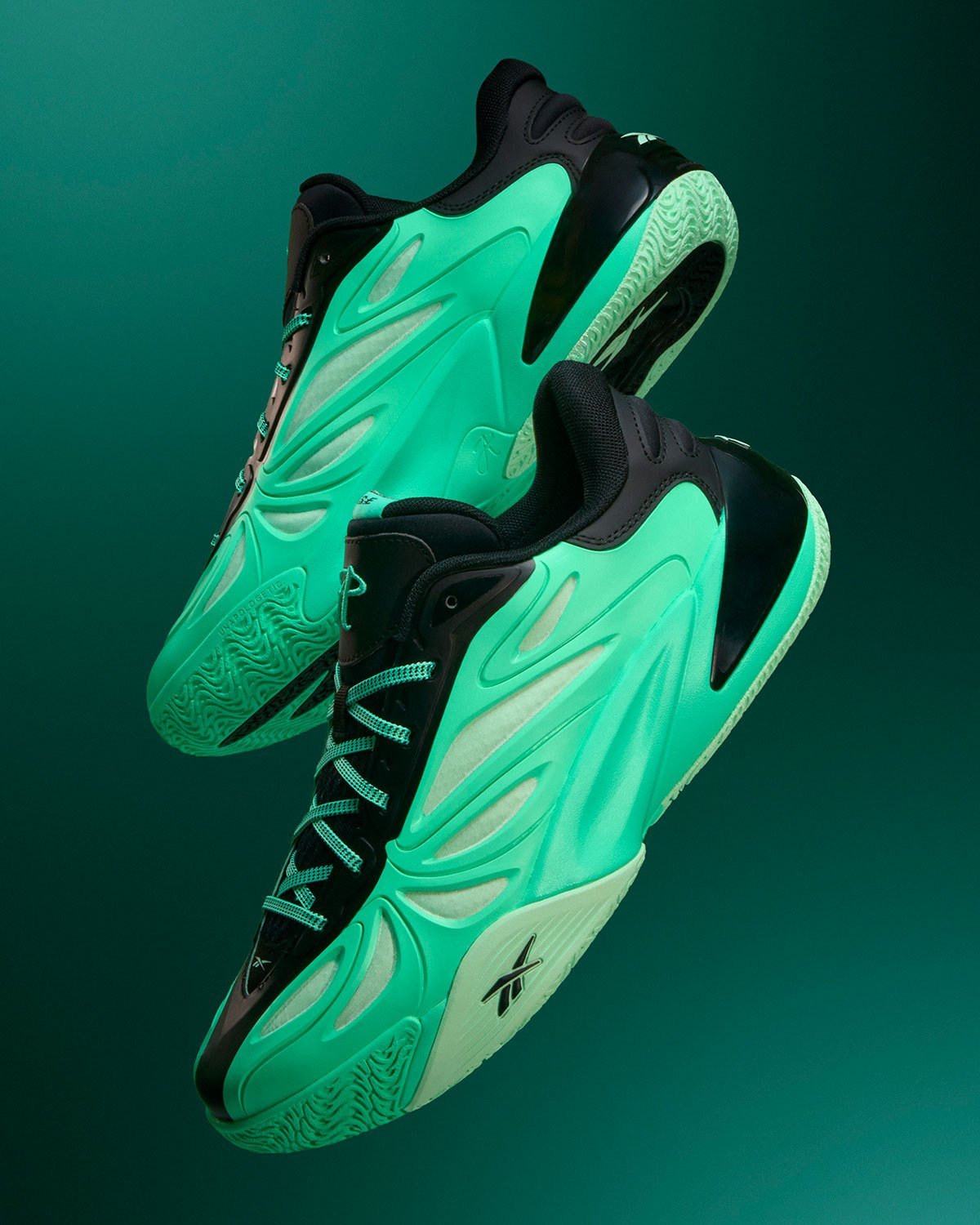 Reebok Angel Reese 1 Metal Green and Aqua colorways displayed side by side, showing muted pastel and vibrant aqua treatments with contrasting heel details - detail view 3