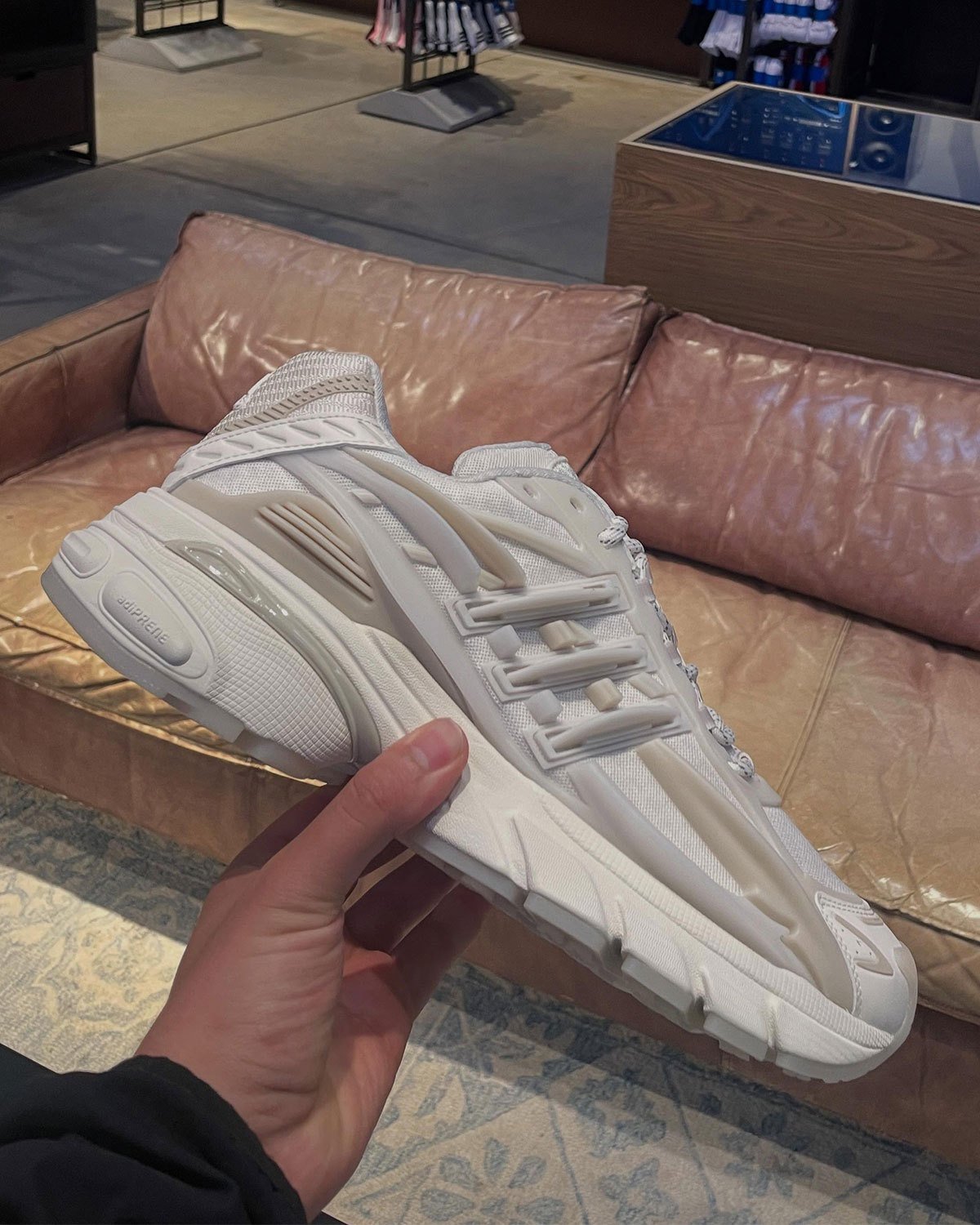 Pharrell x adidas Jellyfish Triple White sneaker in full white colorway, showing layered upper construction and extended toe box from multiple angles - detail view 3