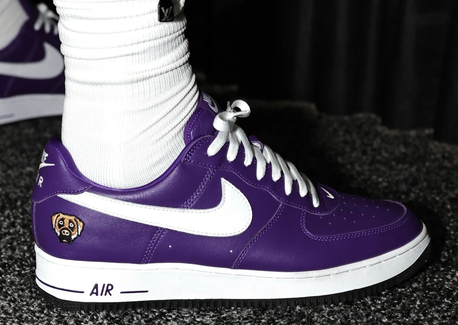 LeBron James wearing Victor Victor x Nike Air Force 1 '01 Low in purple with dog head logo on heel - detail view 1