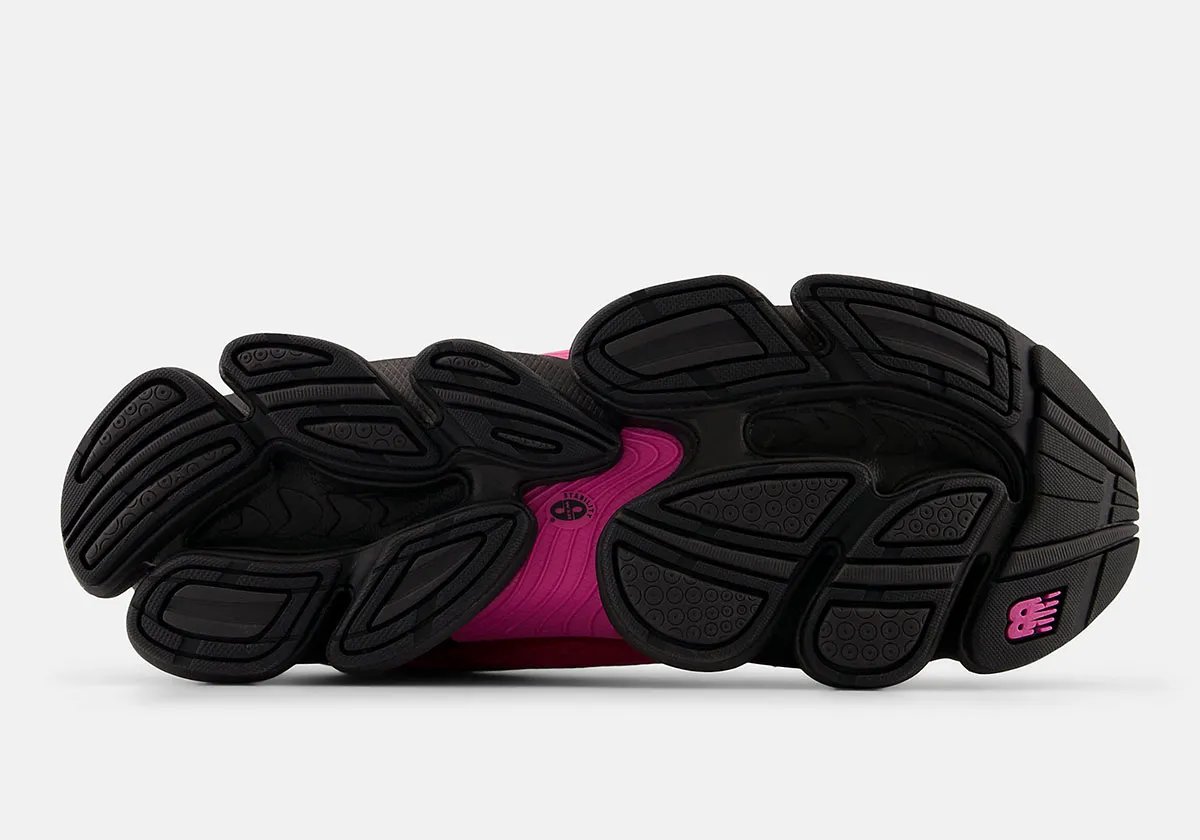 New Balance 2000 in Pink Heat colorway, showcasing the bulbous toe box and stacked midsole geometry with mesh and synthetic upper construction - detail view 3