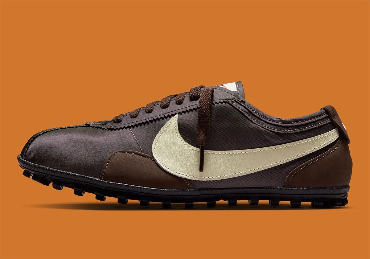 Nike Moon Shoe in Malachite and Baroque Brown colorways featuring oversized Swoosh and gum rubber sole - detail view 1