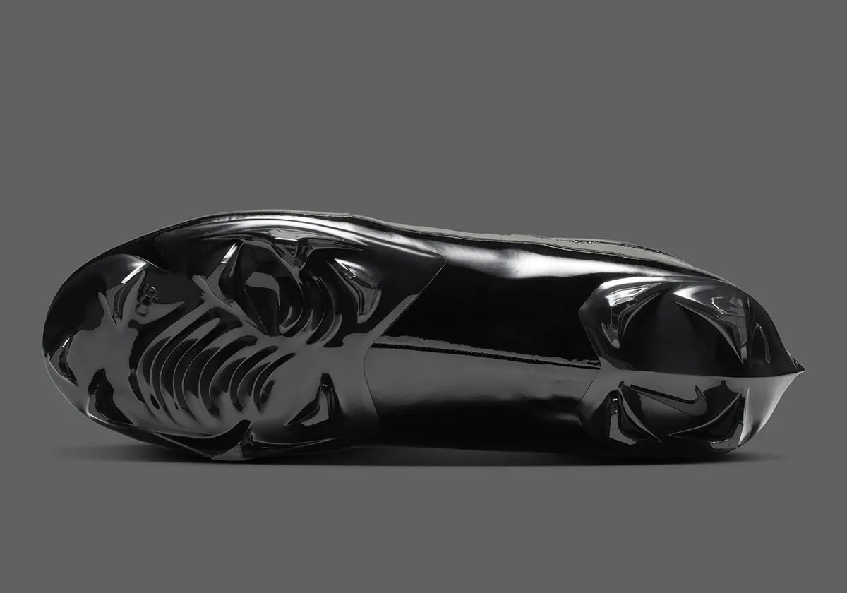 Air Jordan 11 Football Cleat in Anthracite colorway with patent leather collar and carbon fiber shank detail - detail view 5