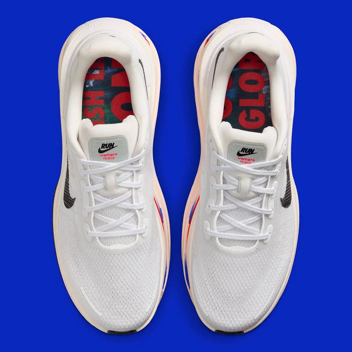 Nike running collection in white with royal blue diagonal midsole striping across Zoom Air units - detail view 3
