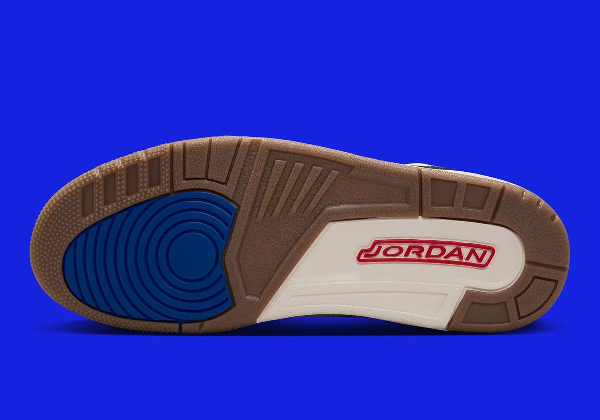 Jordan Spiz'ike Low FC in University Red and Sail with Nike Football logo on tongue and gum brown outsole - detail view 1