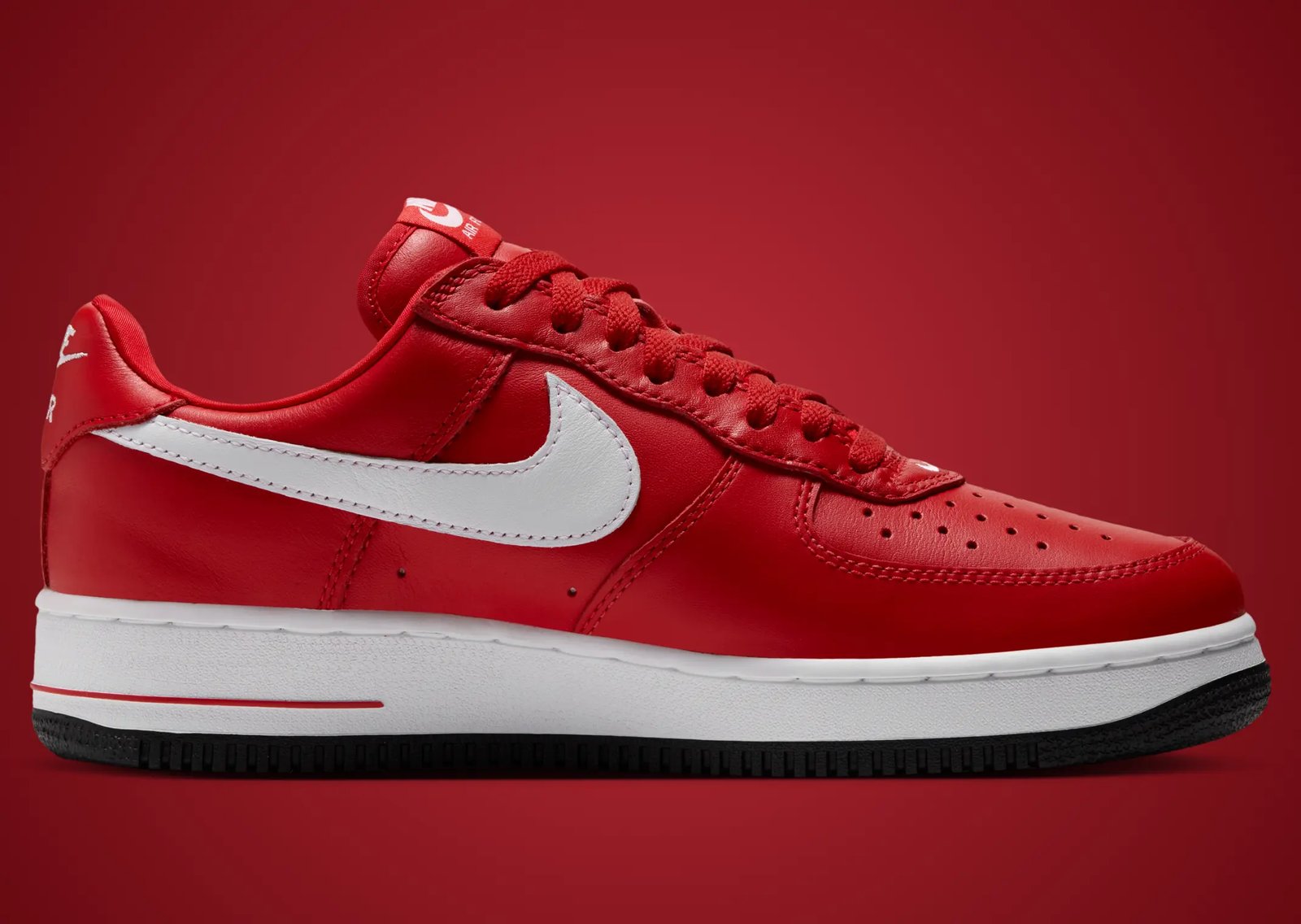 Victor Victor x Nike Air Force 1 Low '01 in Yellow and University Red, featuring monochrome plush leather with white Swoosh and custom dog head logo on lateral heel - detail view 5