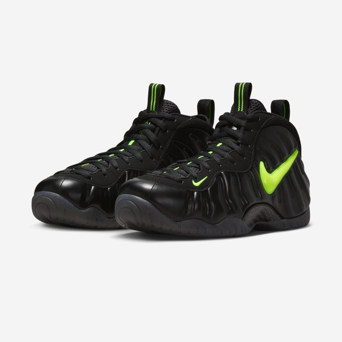Nike Air Foamposite One Voltage colorway showcasing the signature monoblock foam shell construction - detail view 1