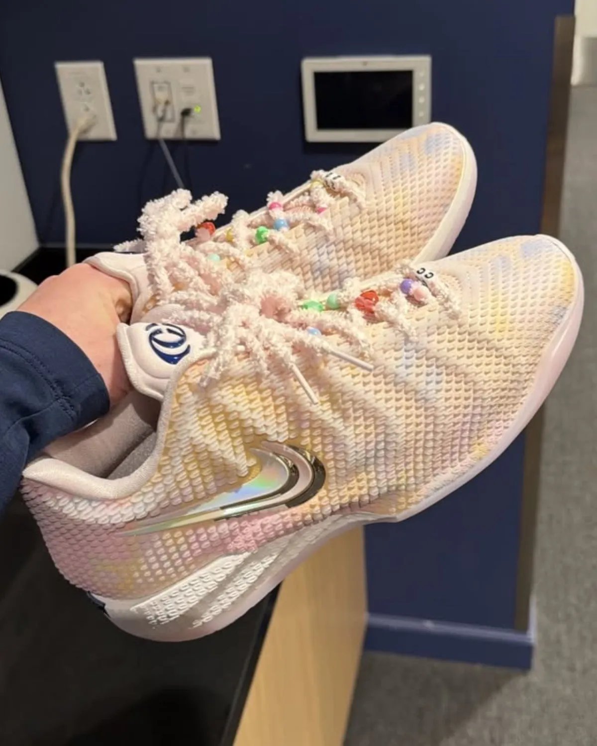 Nike Caitlin 1 'Friendship Bracelet' in Pearl Pink and Racer Blue with iridescent upper and charm-adorned laces, inspired by Taylor Swift's Eras Tour aesthetic - detail view 3