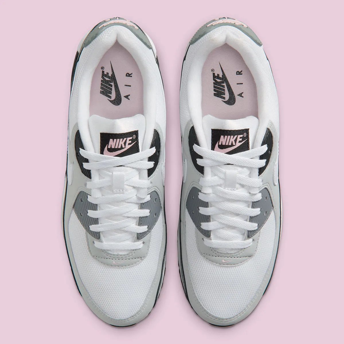 Nike Air Max 90 in Pink Foam colorway with visible Air unit and curved Swoosh geometry - detail view 3