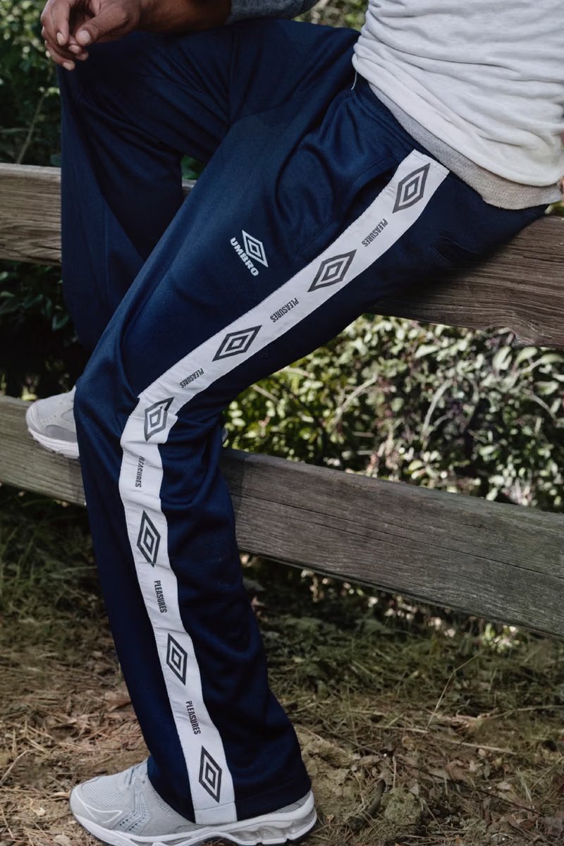 PLEASURES x Umbro capsule collection featuring oversized football shirts and track jackets inspired by 1990s British terrace and music culture - detail view 2