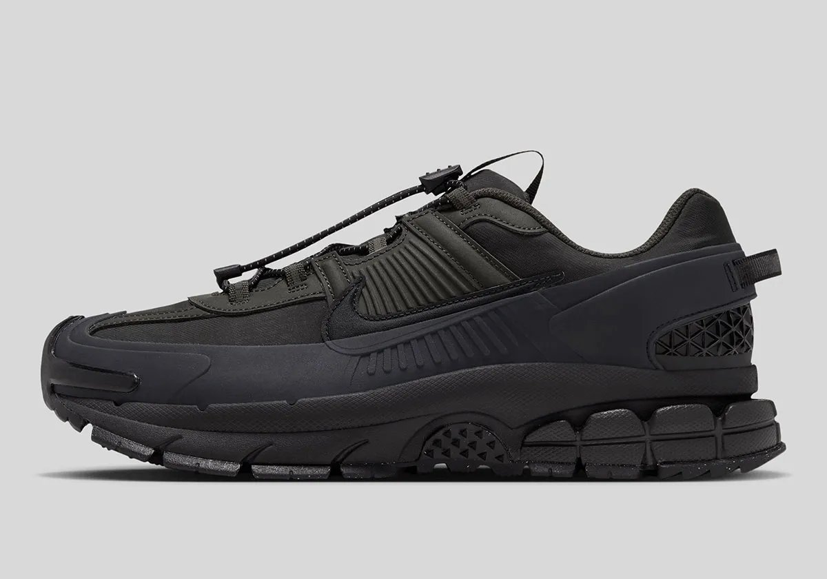 Nike Zoom Vomero 5 Roam in Sequoia and Black colorway with reinforced mudguards and updated traction pattern - detail view 1