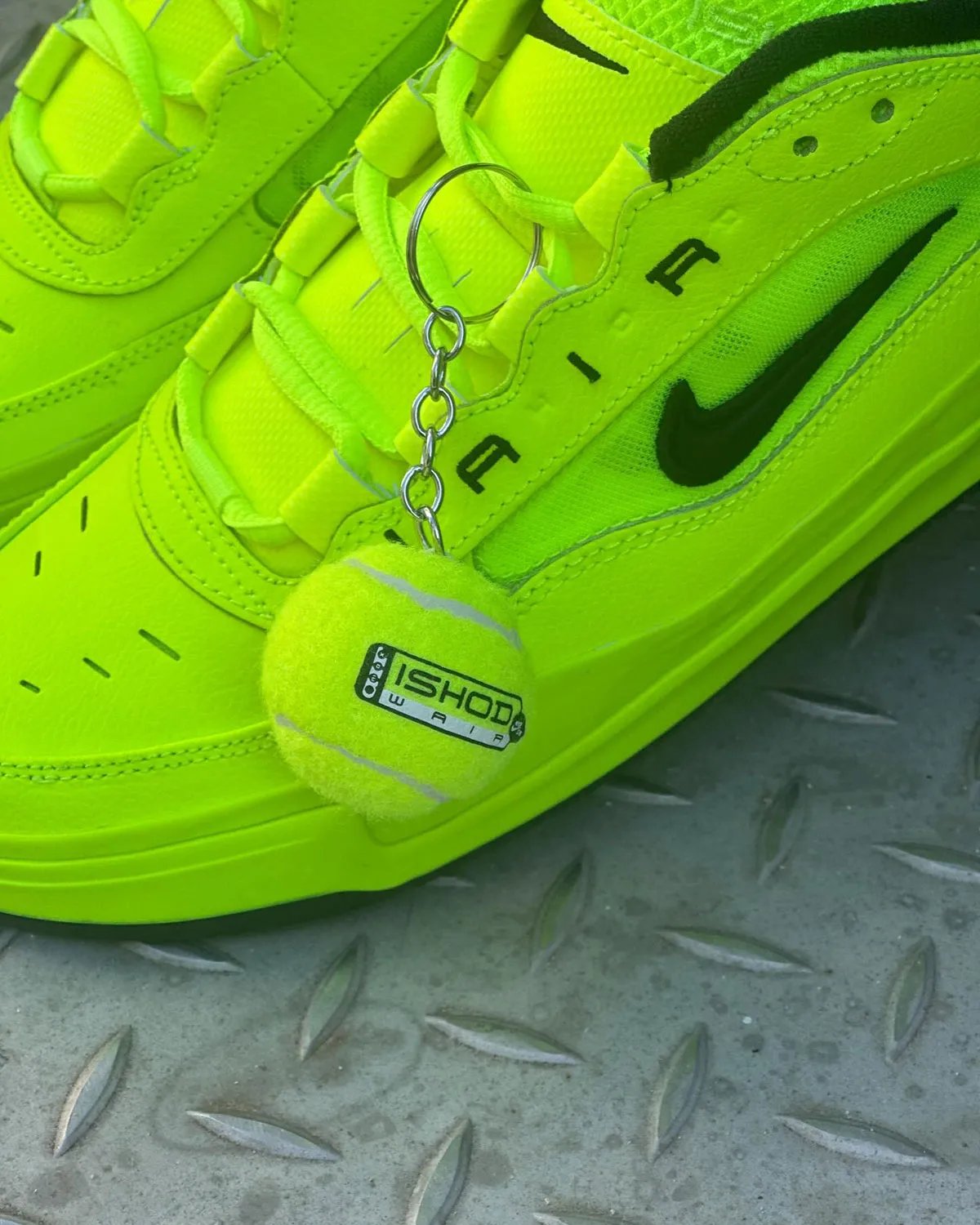 Nike SB Air Max Ishod in neon green tennis ball colorway with black accents and branded tennis ball hangtag - detail view 2