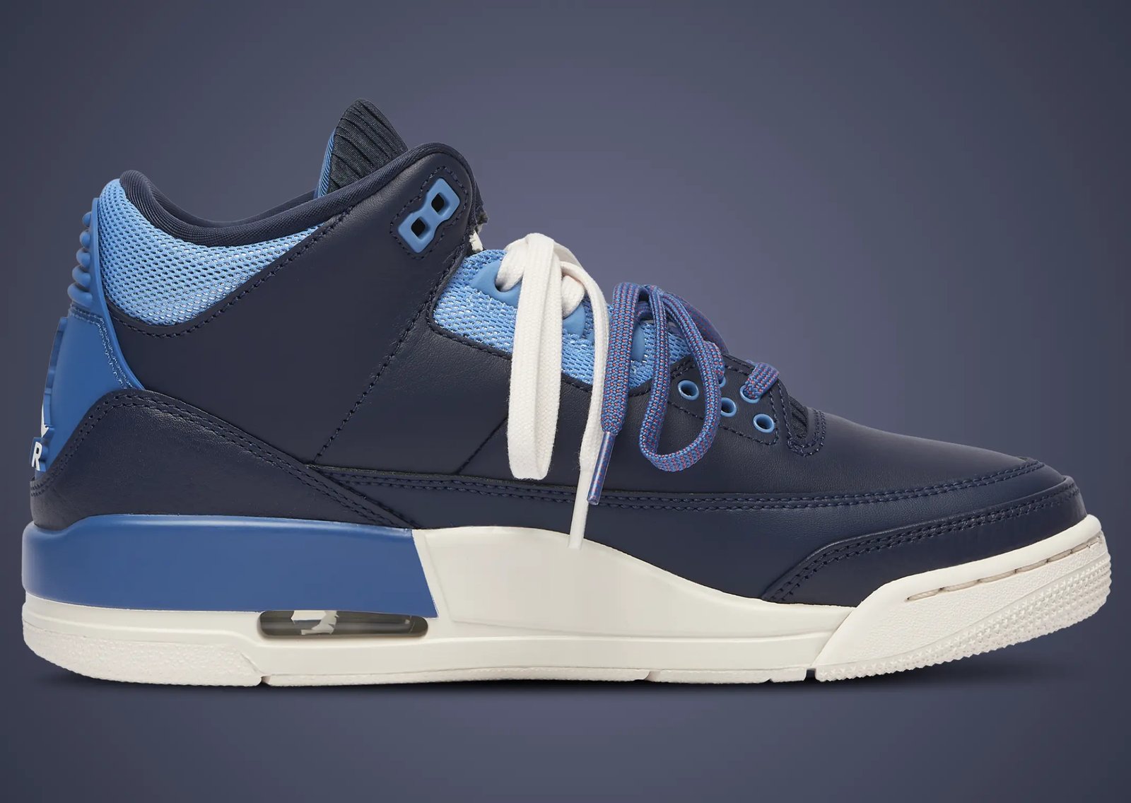 Air Jordan 3 Retro Sports Renaissance women's exclusive showing asymmetric navy, baby blue, and pink colorway with jogger-style tongue detail - detail view 4