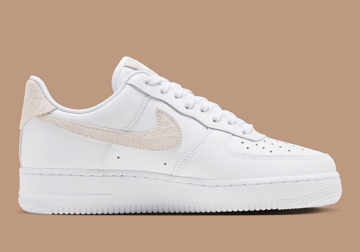 Women's Nike Air Force 1 Low in white leather with tan snakeskin Swoosh and detachable golden charm accessories - detail view 2