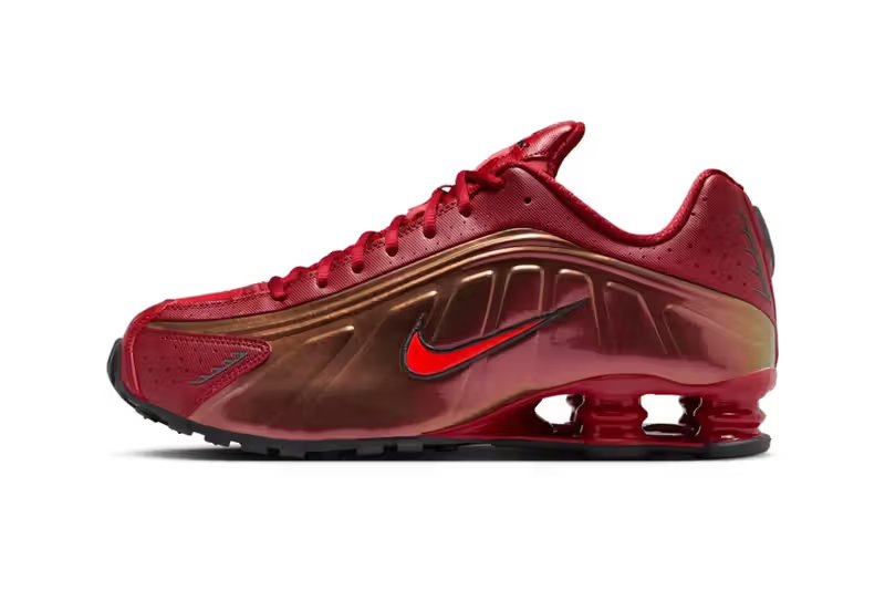 Nike Shox R4 in Team Crimson and Black colorway, side view showing column spring technology and Iron Man-inspired aesthetic - detail view 3