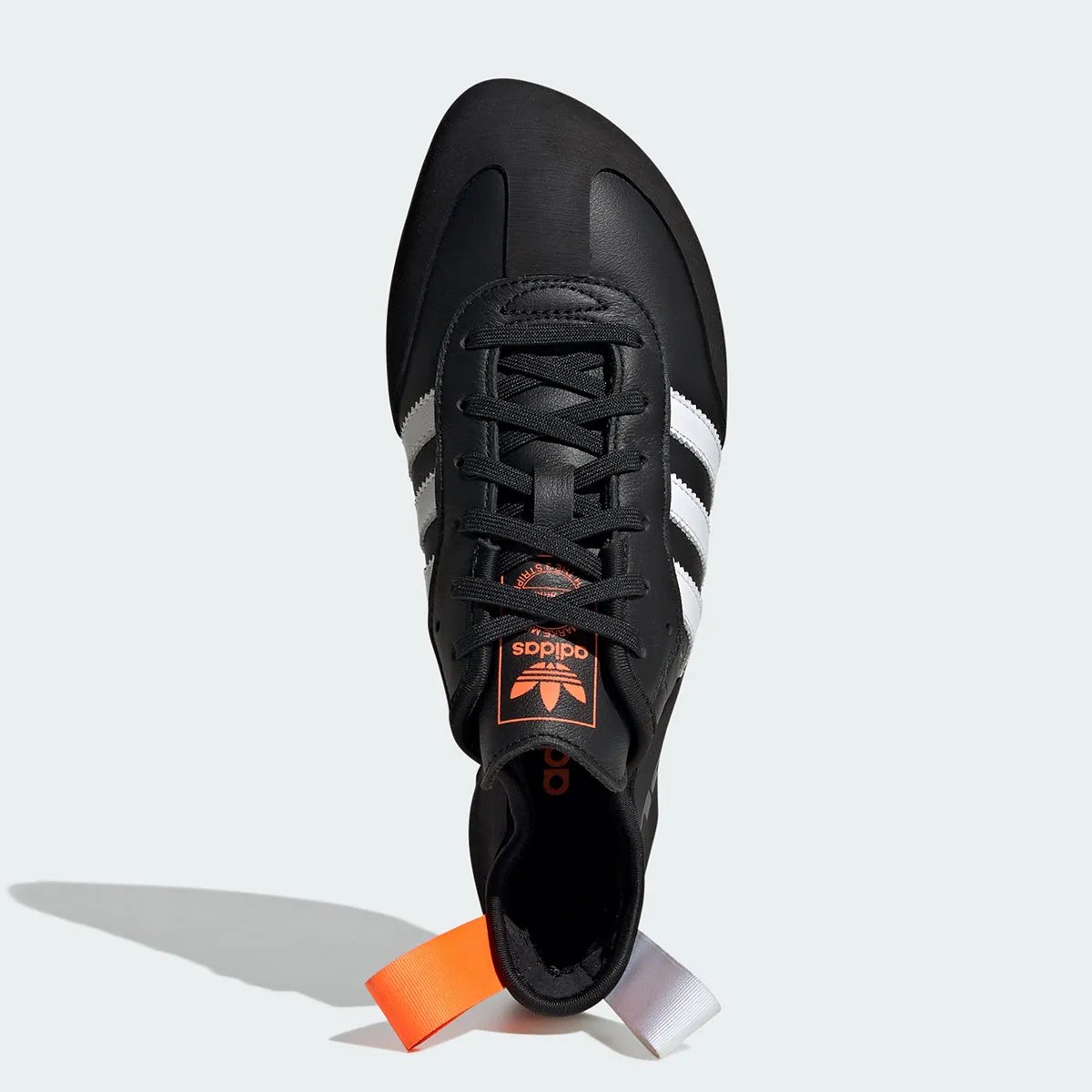 Adidas Samba Climbing Shoe in black, white, and orange colorway with curved Five Ten STEALTH Rubber outsole - detail view 4