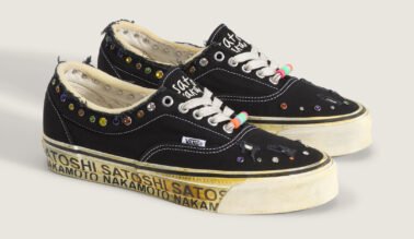 Travis Barker x Vans Old Skool in White and Black colorway, side angle showing classic Old Skool silhouette with collaboration branding - detail view 2