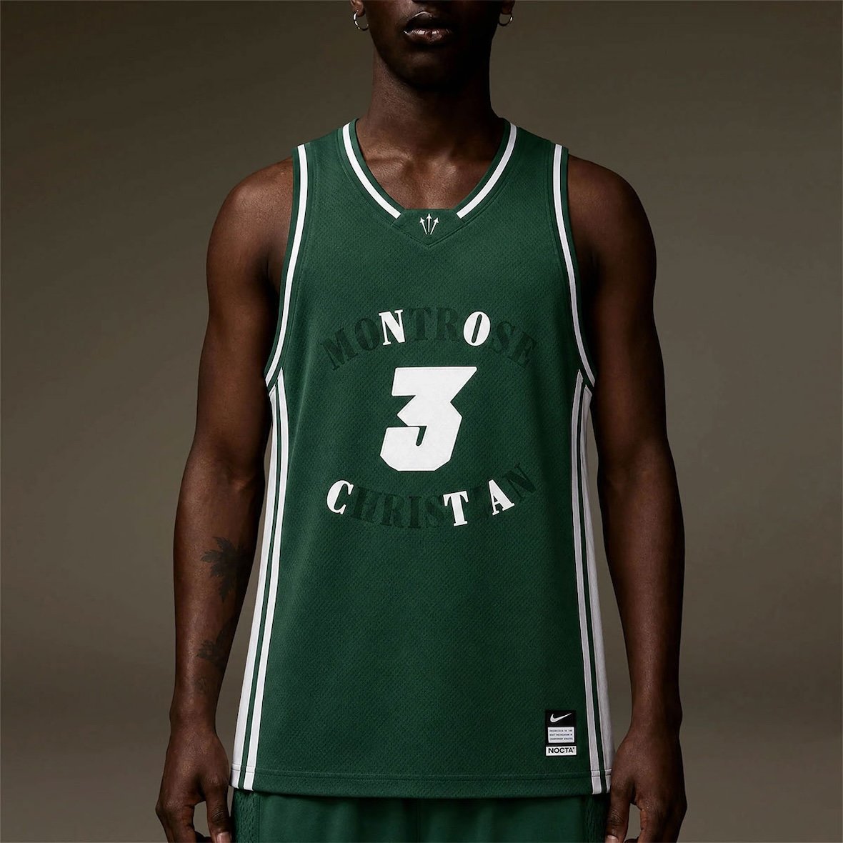 Drake and Kevin Durant NOCTA apparel collection featuring forest green hoodie, jersey, and performance wear with Easy Money graphics - detail view 5