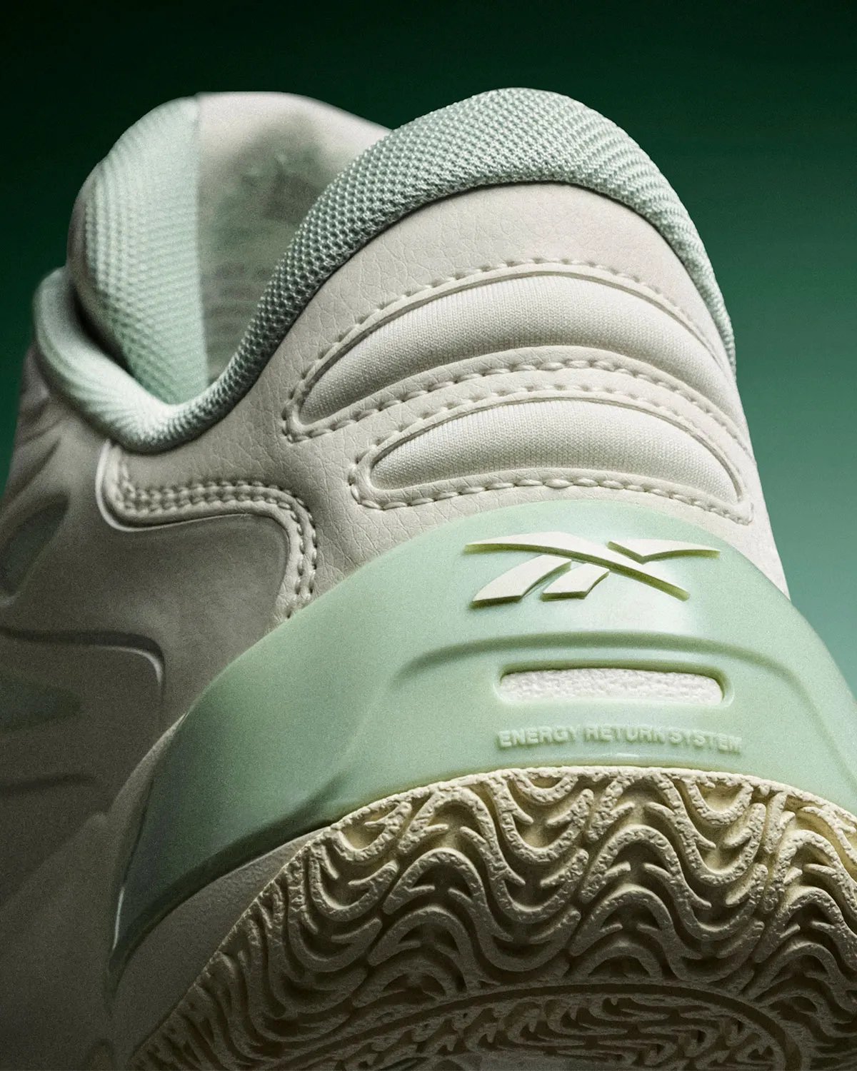 Reebok Angel Reese 1 Metal Green and Aqua colorways displayed side by side, showing muted pastel and vibrant aqua treatments with contrasting heel details - detail view 2