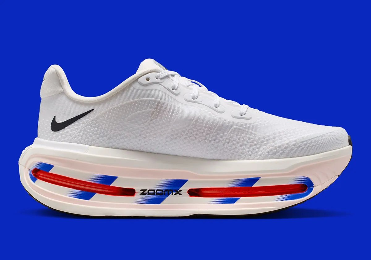 Nike running collection in white with royal blue diagonal midsole striping across Zoom Air units - detail view 2