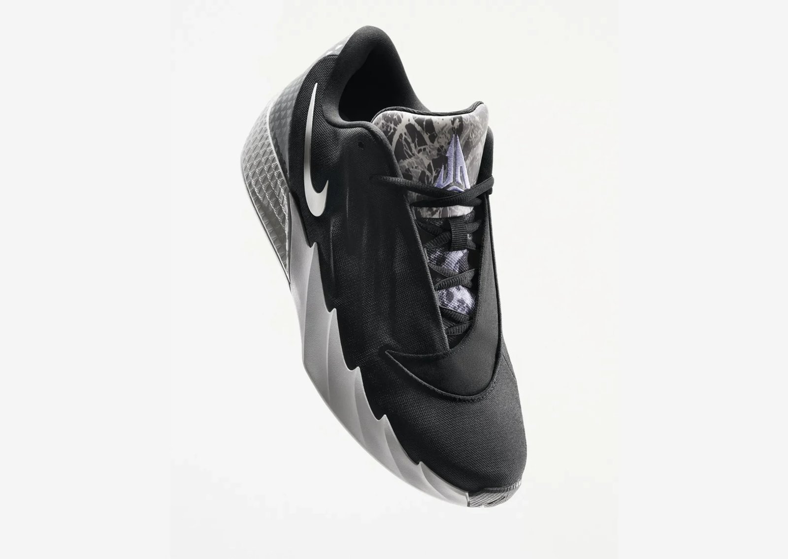 Nike Twelve Time Ja Morant signature sneaker in Black/White colorway with mesh upper and textured wave side panels - detail view 2
