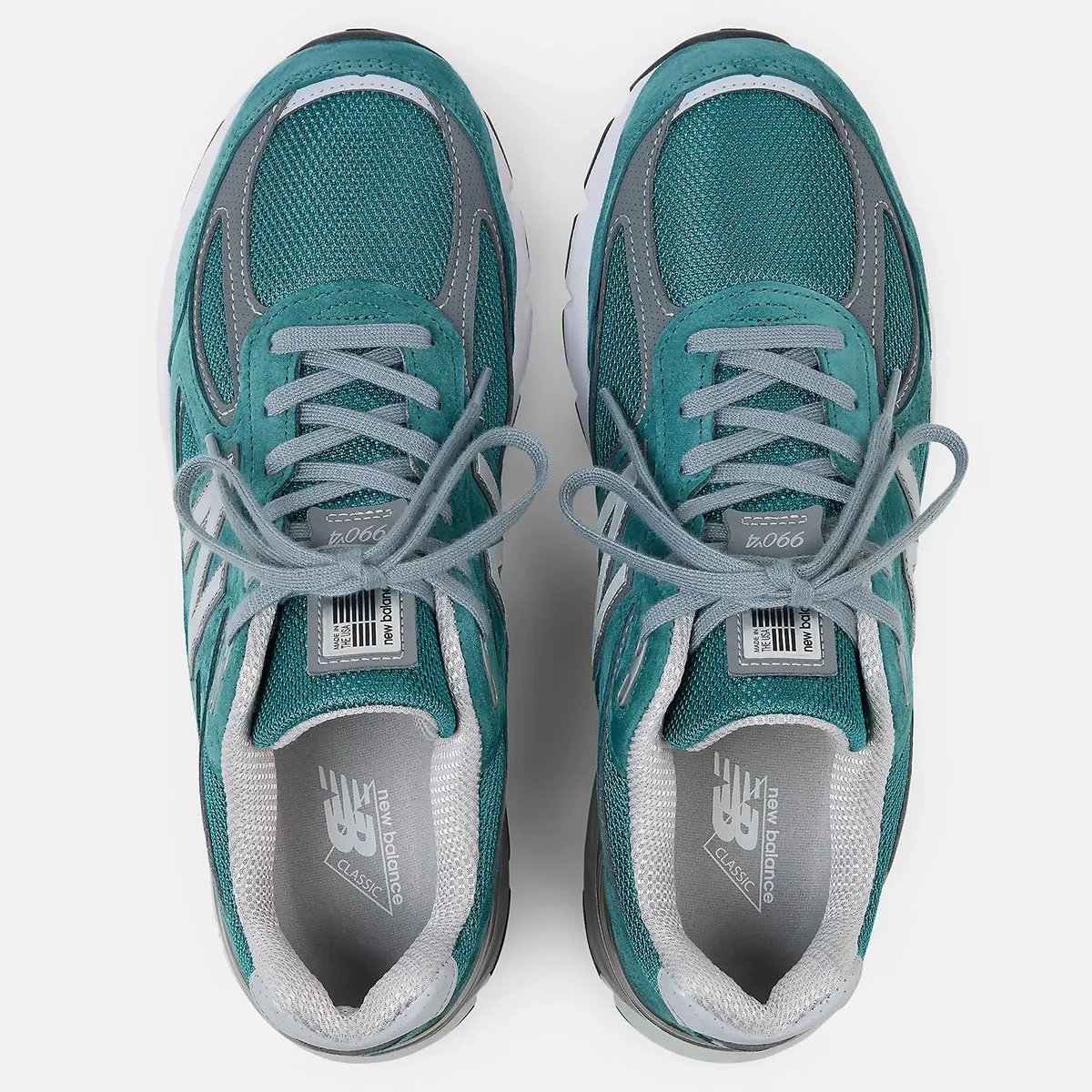 New Balance 990v4 in teal with grey accents, side profile view - detail view 1