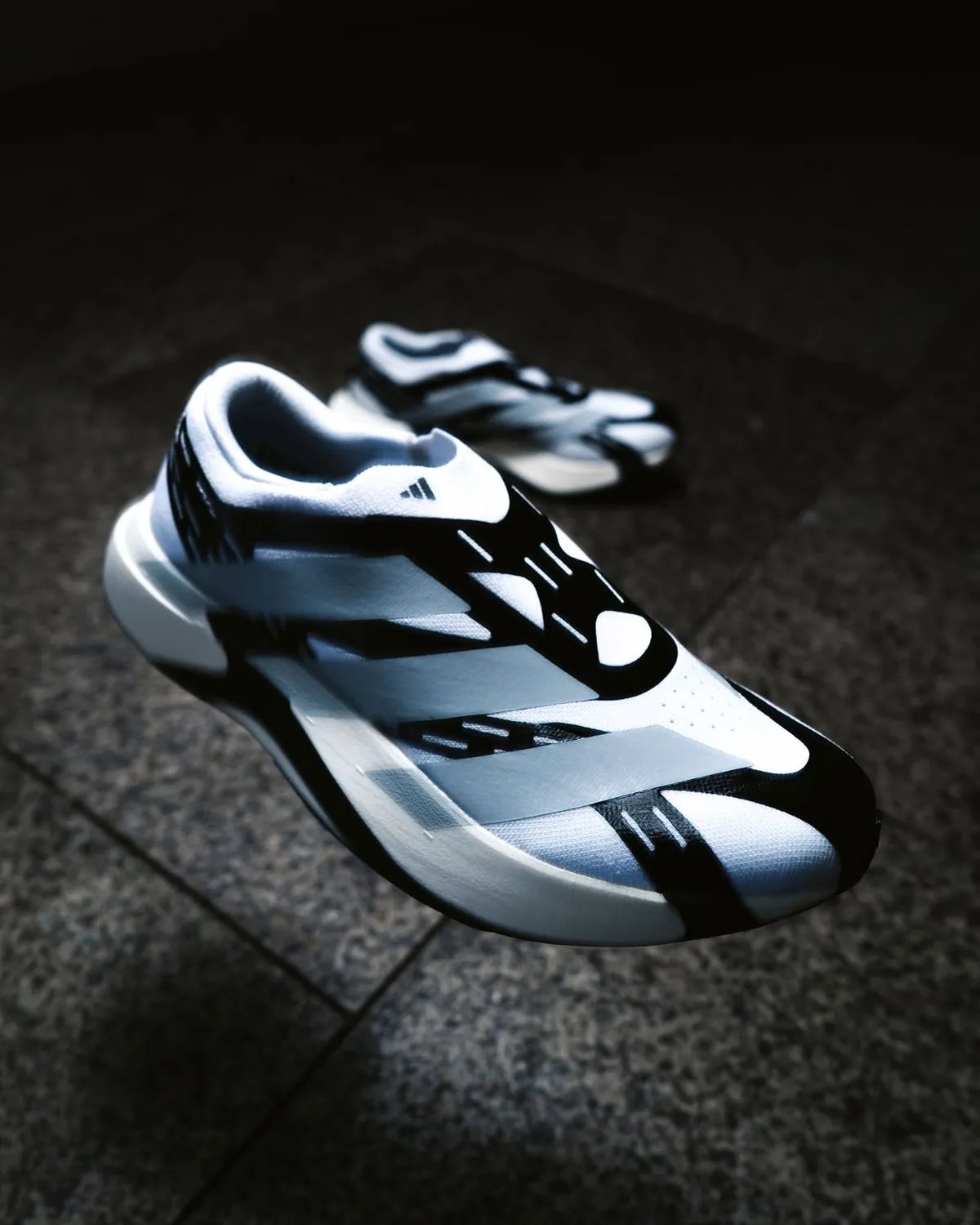 adidas EVO SL Laceless in profile, showing reinforced synthetic layers and minimal sock-collar construction - detail view 3