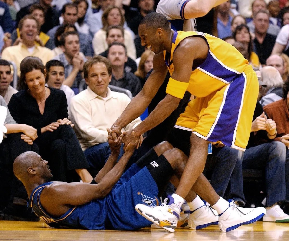 Kobe Bryant's Air Jordan 8 PE in white and black Lakers colorways, shown side by side - detail view 3