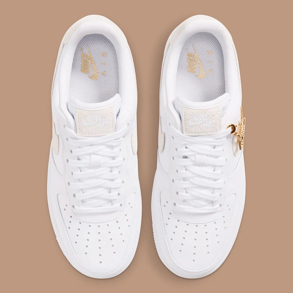 Women's Nike Air Force 1 Low in white leather with tan snakeskin Swoosh and detachable golden charm accessories - detail view 3