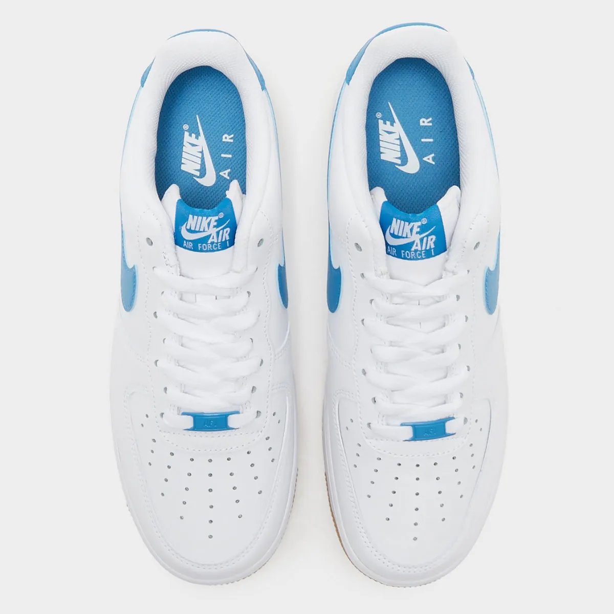 Nike Air Force 1 Low Aurora Blue with white leather upper, blue accents, and gum rubber sole - detail view 1