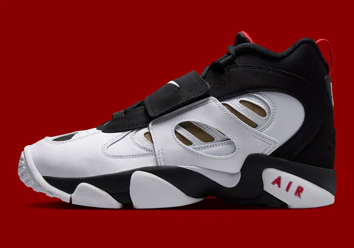 Nike Air Diamond Turf 2 '49ers' in black and white leather with red and gold accents, honoring Deion Sanders' 49ers season - detail view 1