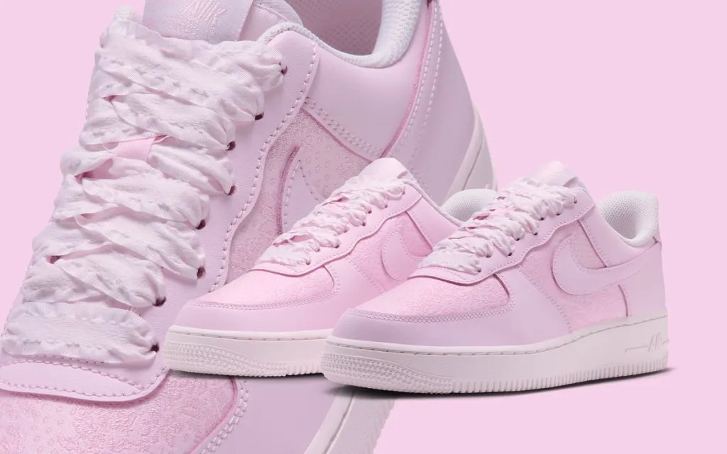 Nike Air Force 1 Low in pink jacquard with ribbon laces, angled side view