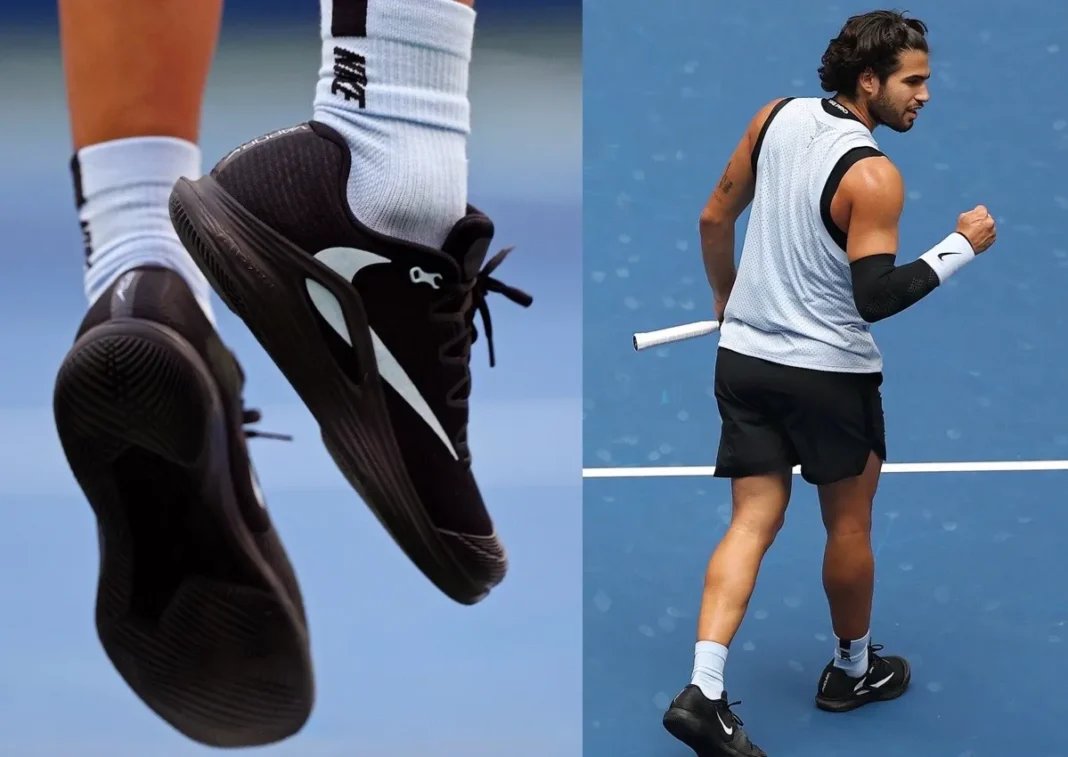 Carlos Alcaraz wearing black Travis Scott x Nike Zoom Vapor 12 with white Reverse Swoosh detail