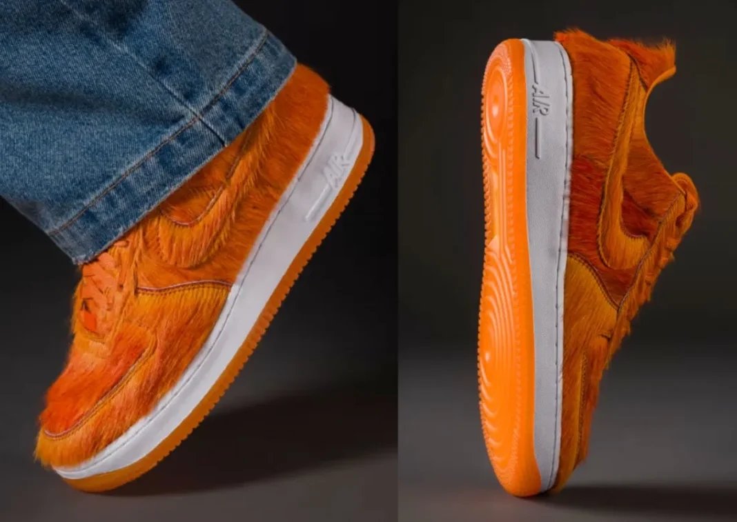 Nike Air Force 1 Low in Campfire Orange pony hair with white midsole, showing full faux fur coverage across upper - detail view 1