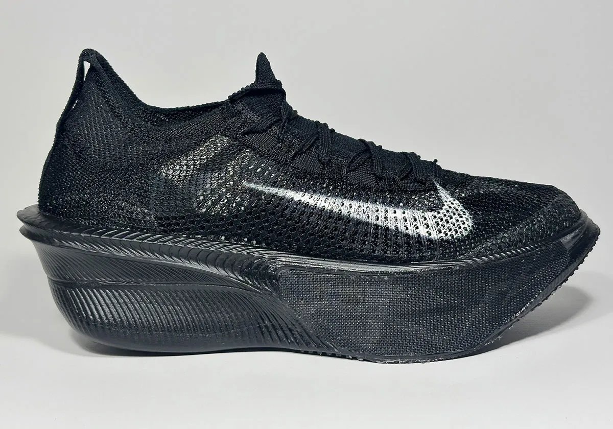 Nike AlphaFly 4 prototype in all-black colorway with oversized lateral Swoosh design detail - detail view 2