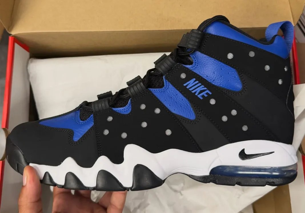 Nike Air Max2 CB '94 Varsity Royal in black nubuck with royal blue leather panels and white midsole, showing the characteristic cutout design and jagged outsole sections - detail view 1