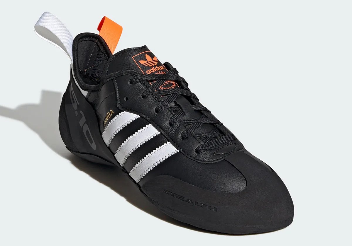 Adidas Samba Climbing Shoe in black, white, and orange colorway with curved Five Ten STEALTH Rubber outsole