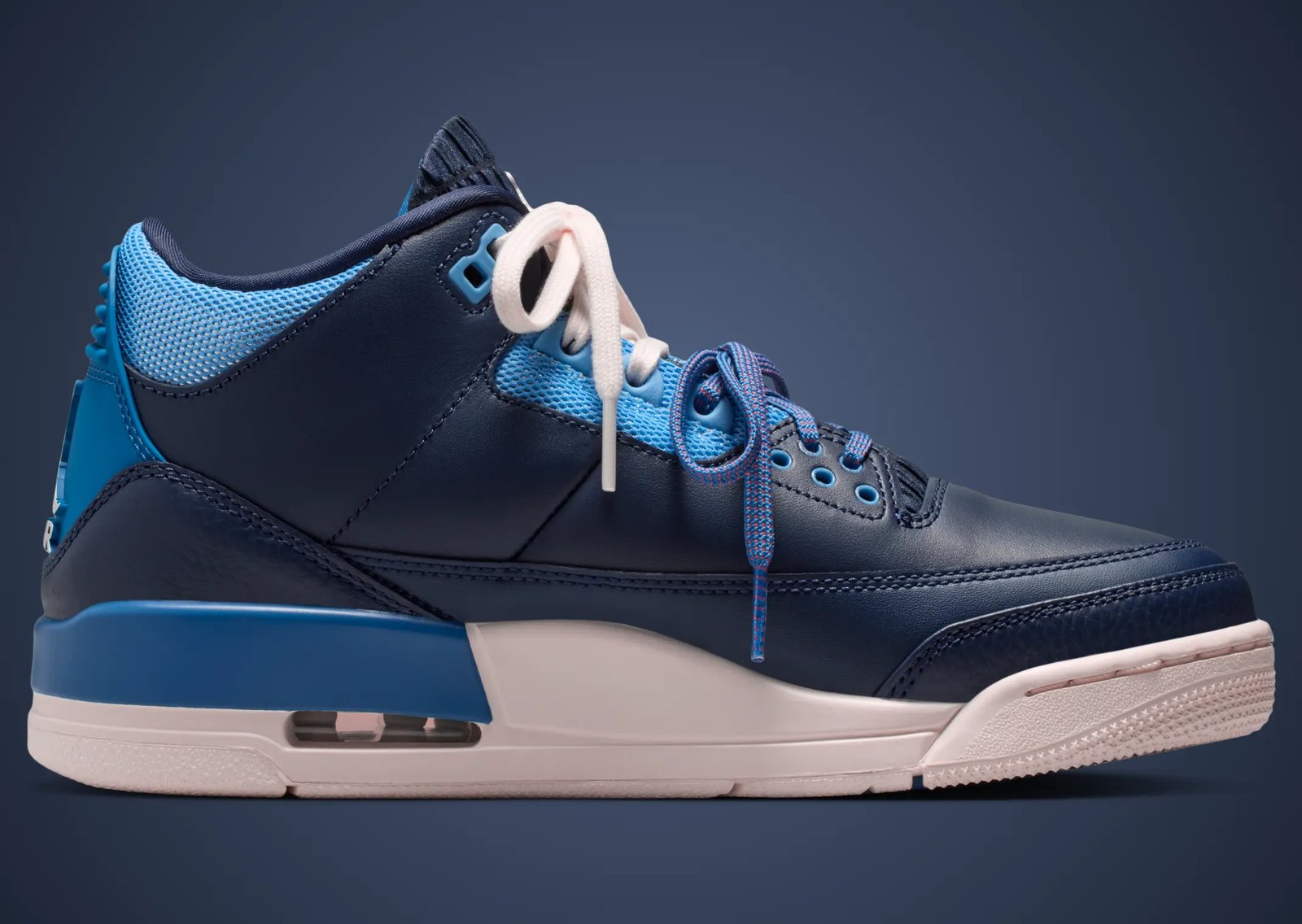Air Jordan 3 Sports Renaissance featuring navy blue upper with mismatched red and blue asymmetrical accents, nylon mesh detailing, and scrunched tongue design - detail view 4