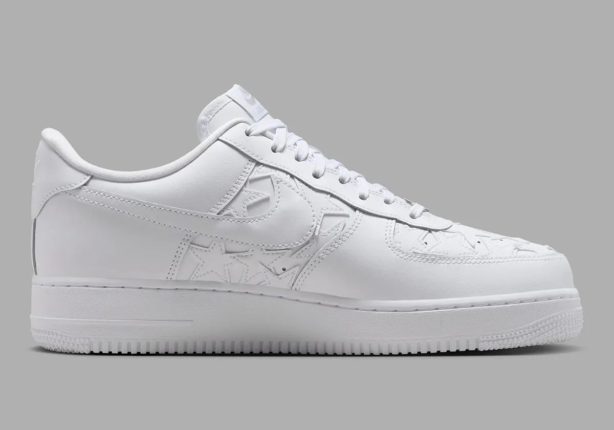 Nike Air Force 1 Low in Triple White with star-motif leather patches on the quarter panel and toe box - detail view 2