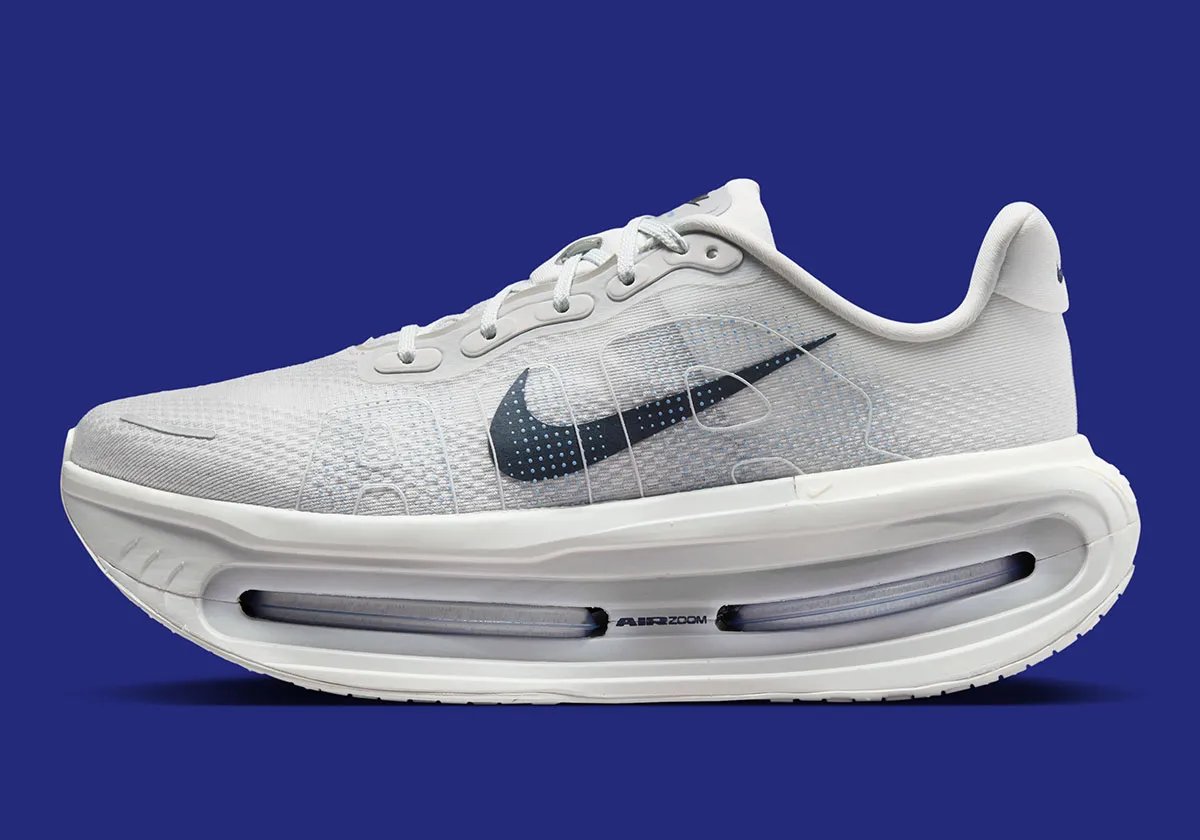 Nike Vomero Premium in Off White colorway with Dark Obsidian Swoosh, lateral view showing 55mm cushioning stack - detail view 1