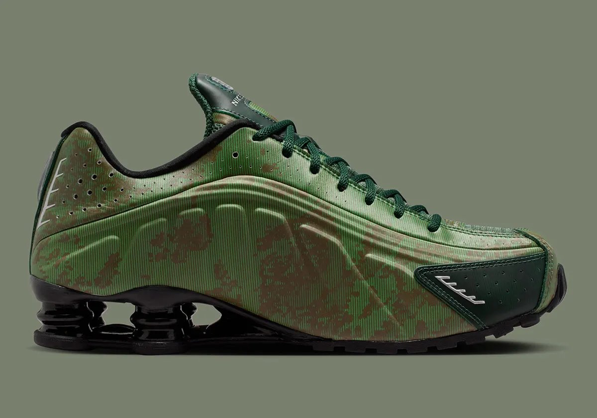 Nike Shox R4 in Team Kelly Green and Rough Green camo with all-black Shox cushioning unit and tactile mini Swoosh detail - detail view 3