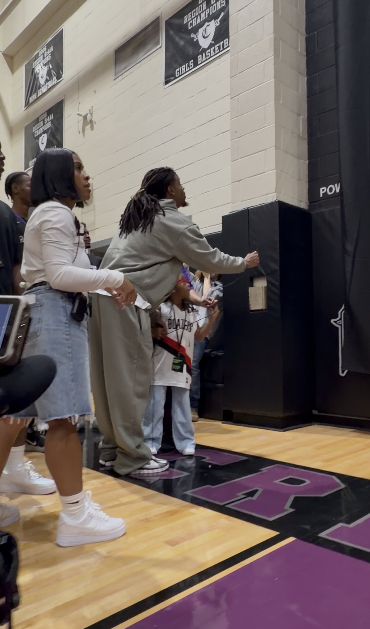 Ja Morant and his daughter Kaari unveil a Nike Ja logo at Crestwood High School during the Nike Ja 4 Dark Mode and Ja Twelve Time launch weekend in Sumter, South Carolina - detail view 4