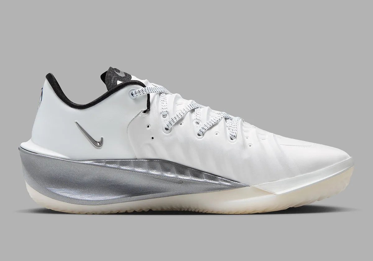 Nike GT Cut 4 SE in Summit White colorway featuring white synthetic upper, black interior, brushed metallic silver heel, and semi-translucent outsole - detail view 3